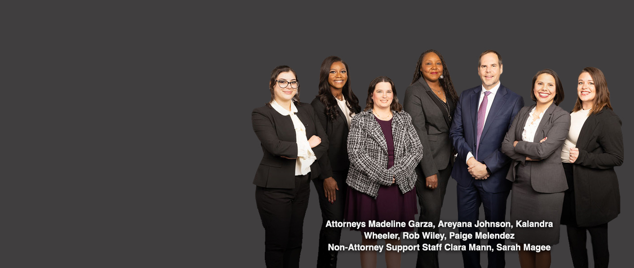 Group picture of Attorneys Madeline Garza, Areyana Johnson, Kalandra Wheeler, Rob Wiley, Paige Melendez, Non-Attorney Support Staff Clara Mann, Sarah Magee
